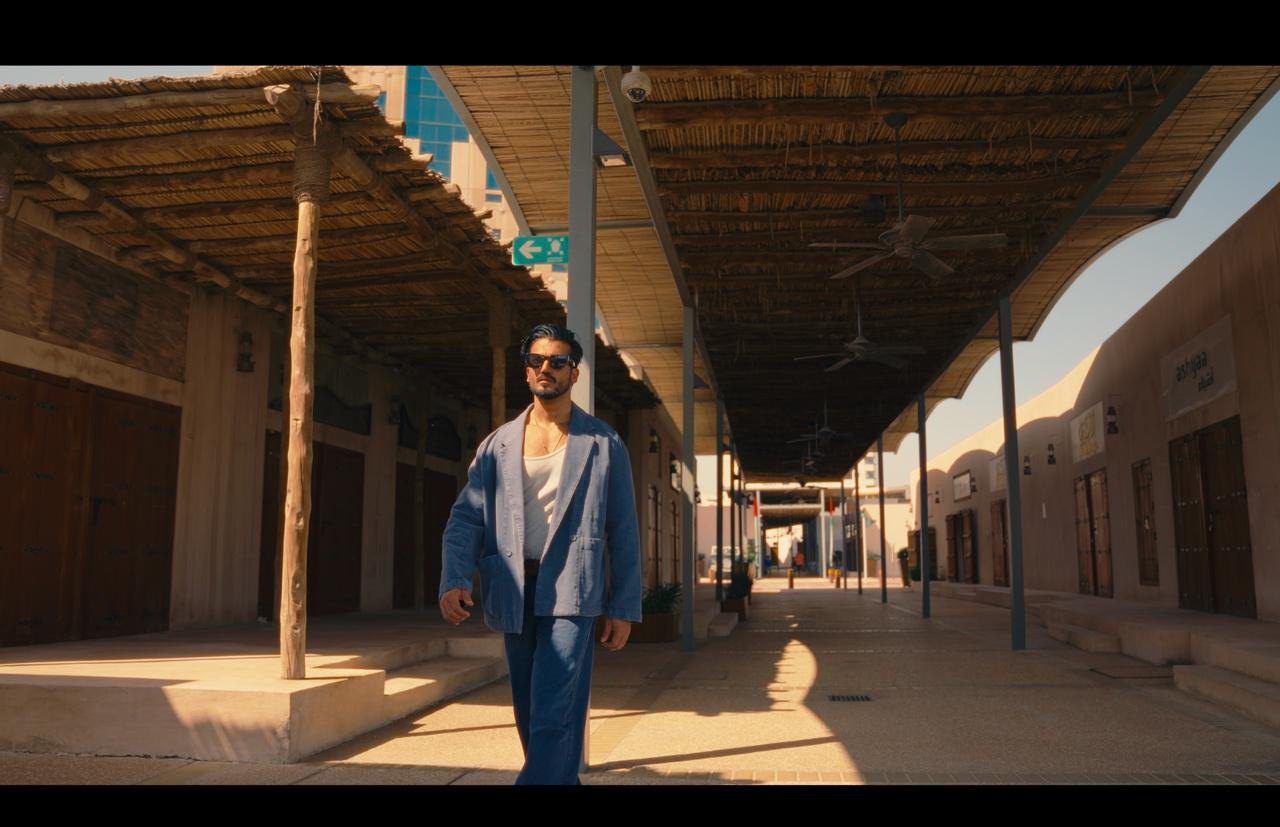 Shaded pedestrian arcade — human register of the film