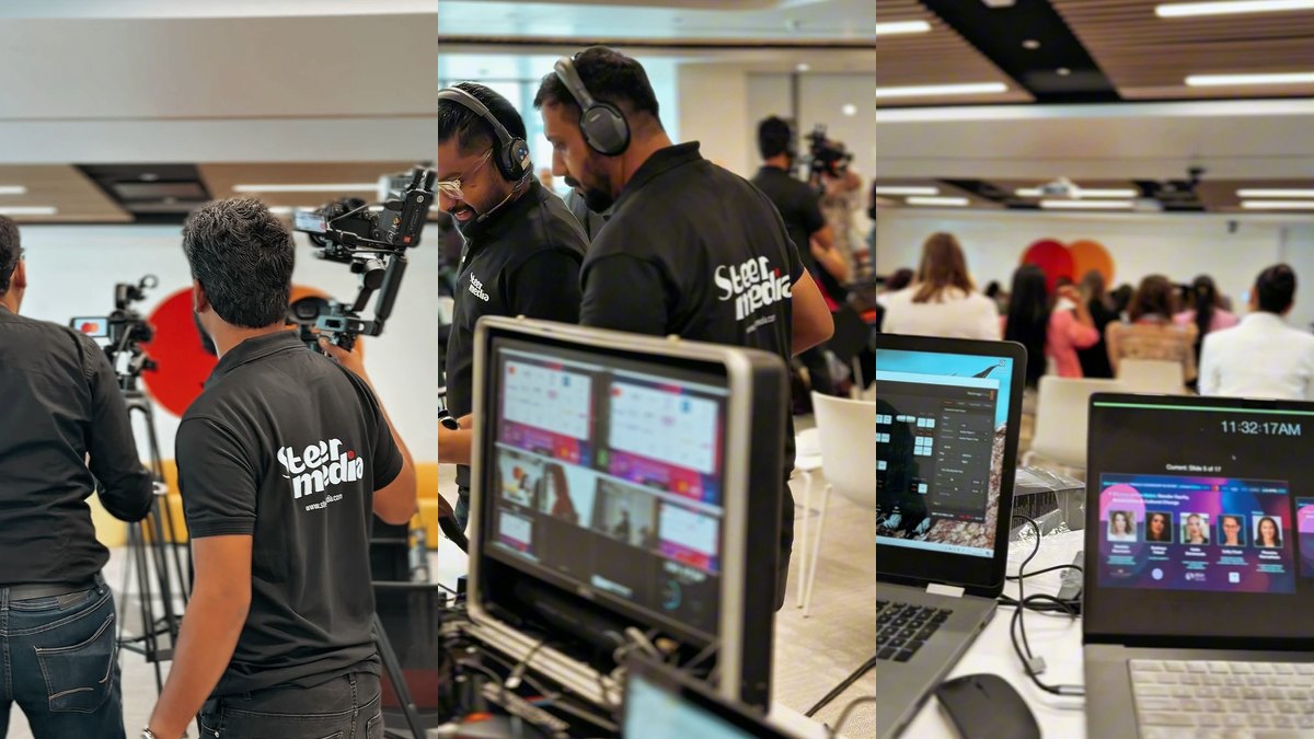 Steer Media crew filming a conference and watching the live monitors at an event in Dubai