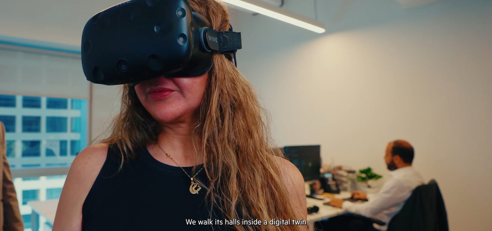 A colleague in a VR headset at the Dubai studio, a frame from our LWK + Partners film