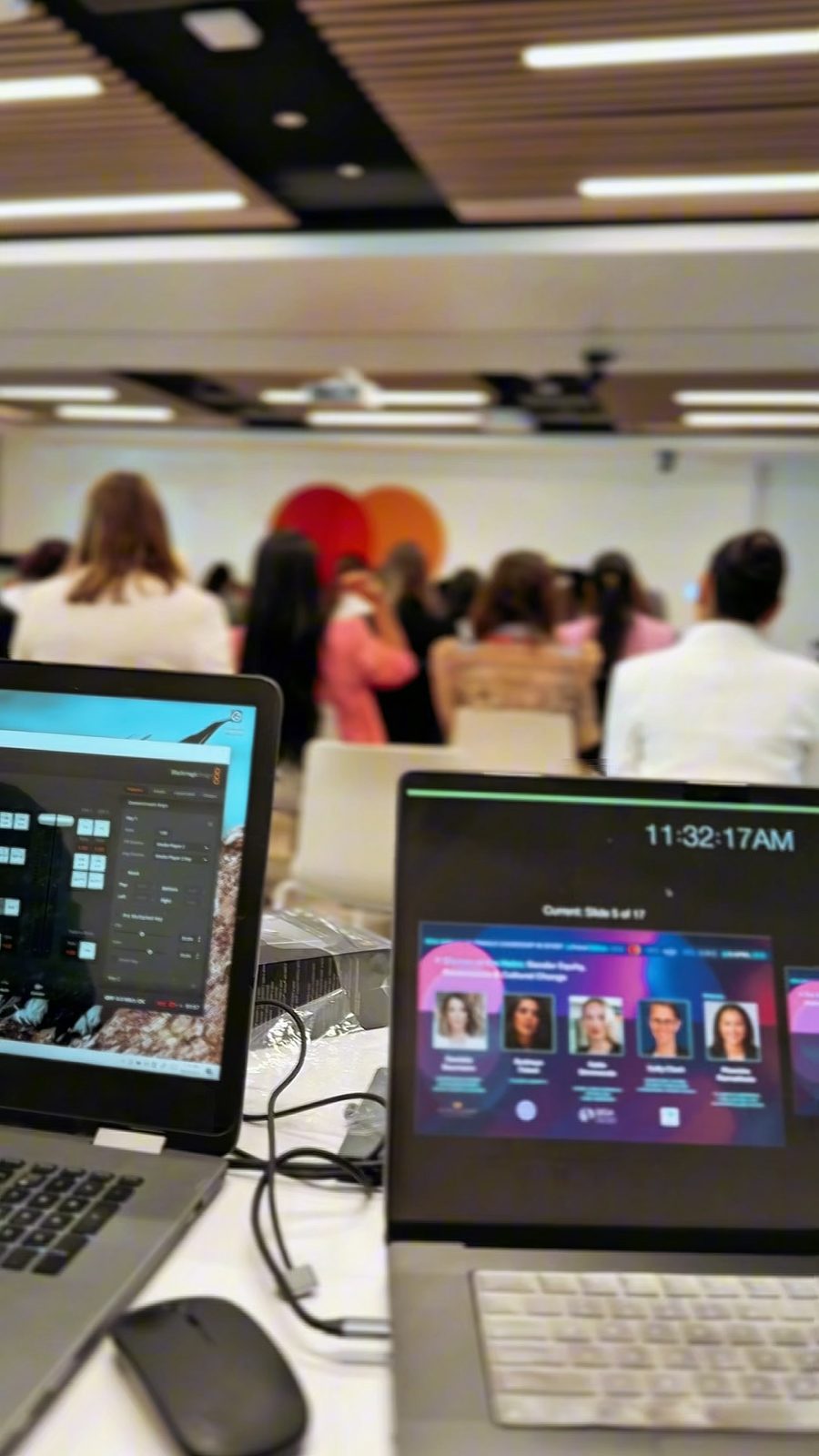 A conference audience and a presenter's laptop, behind the scenes at a Steer Media event shoot