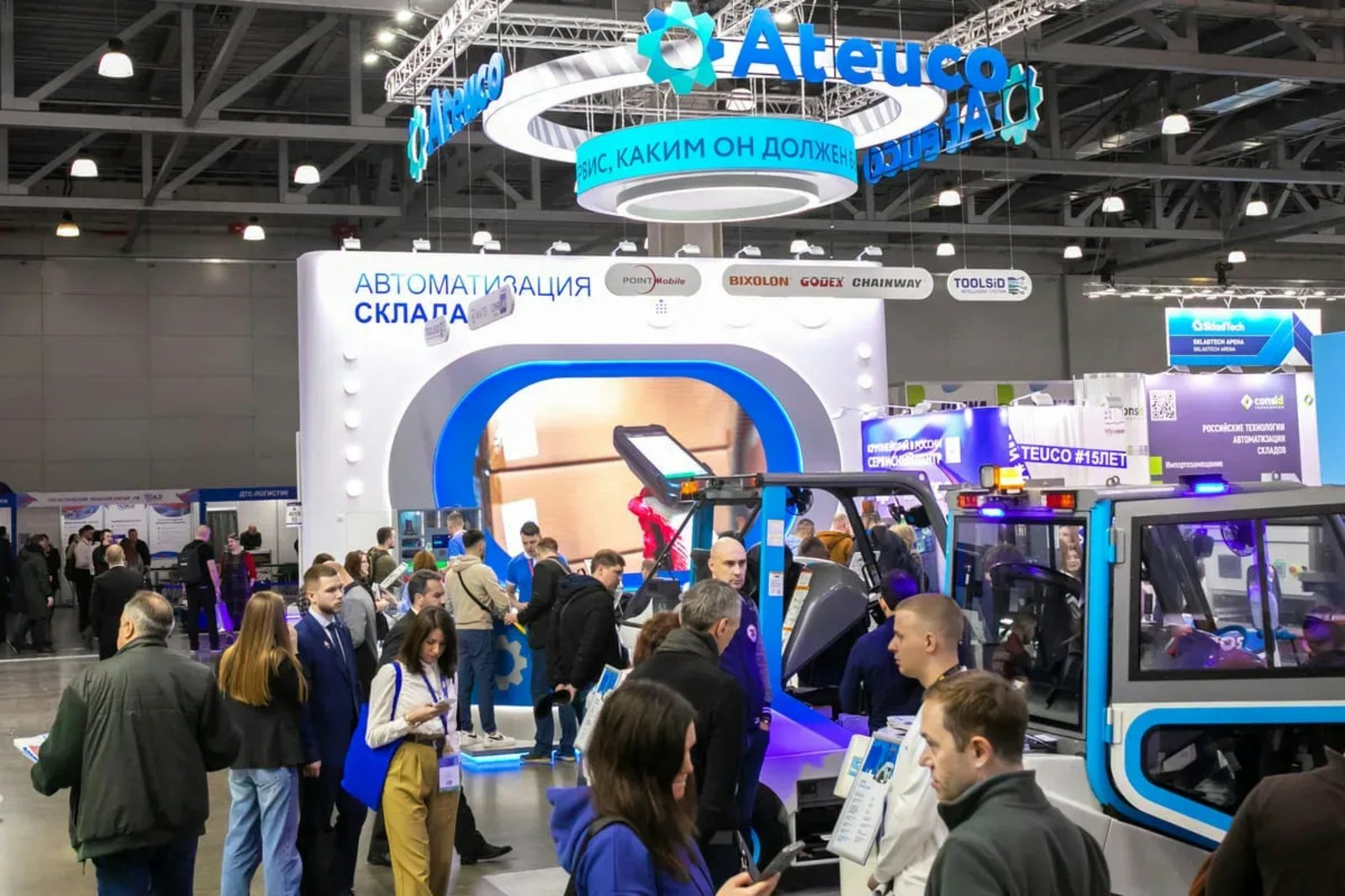 A packed concourse at Gulfood in Dubai, with exhibitor stands and banners on both sides
